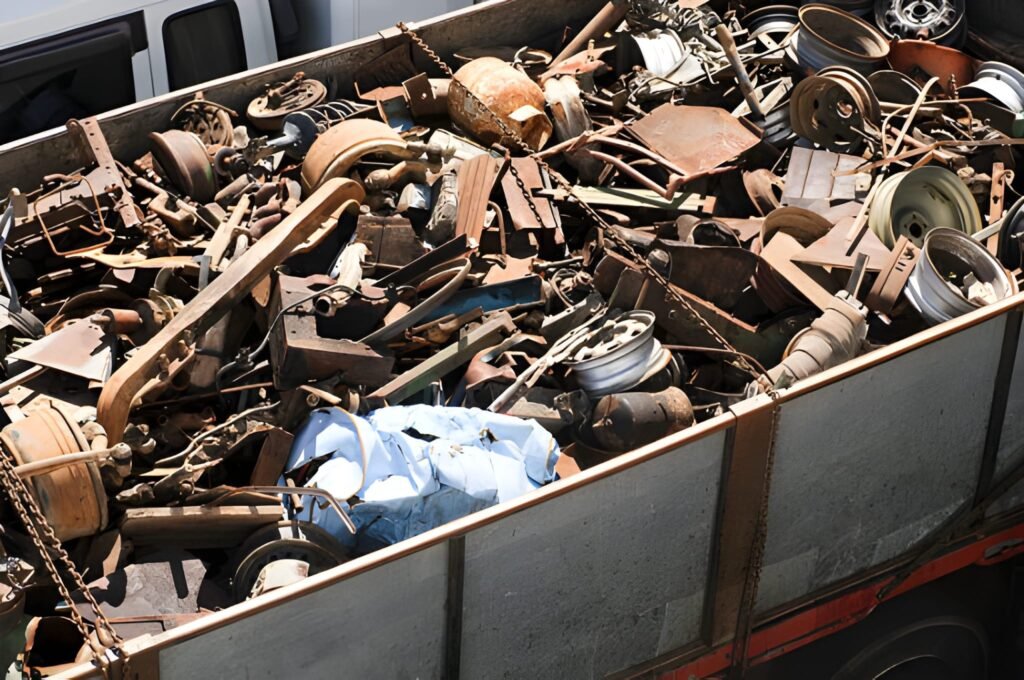 Assorted car and other scrap metal items in a large trailer