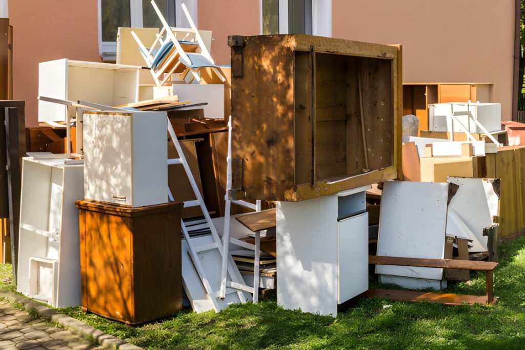 Piled discarded furniture awaiting junk removal