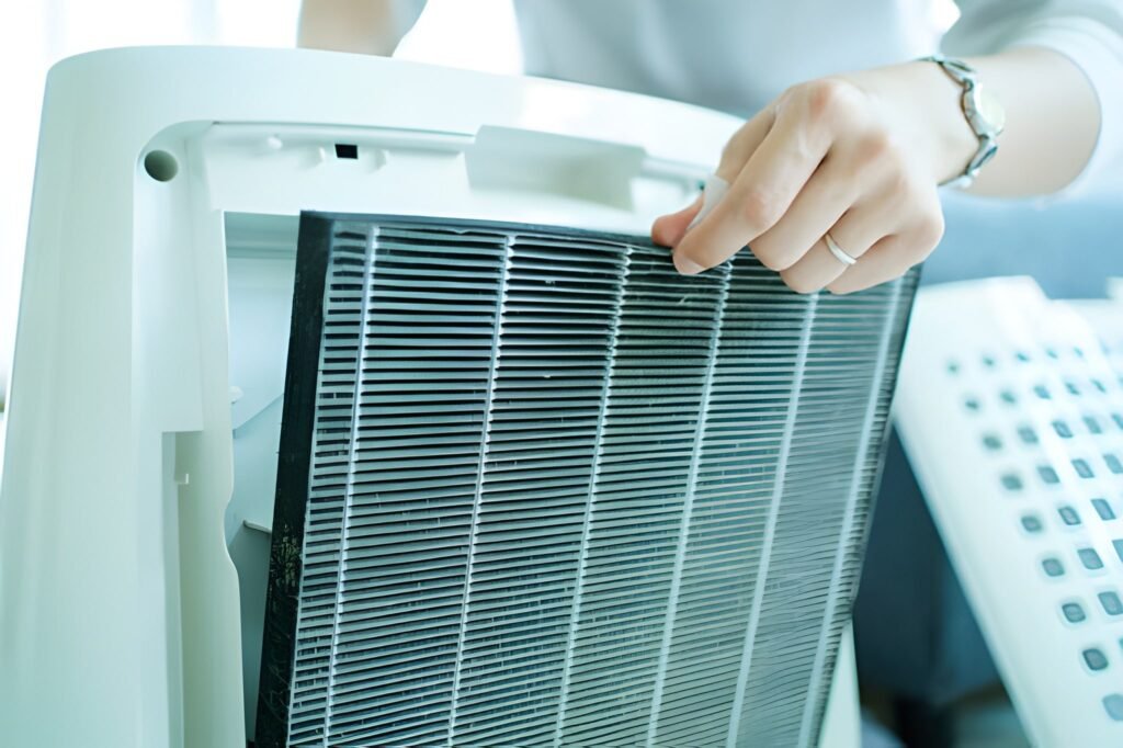 Woman changing air purifier filter