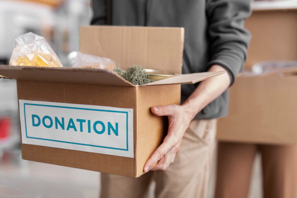 Donation box filled with items, ready for junk removal services.