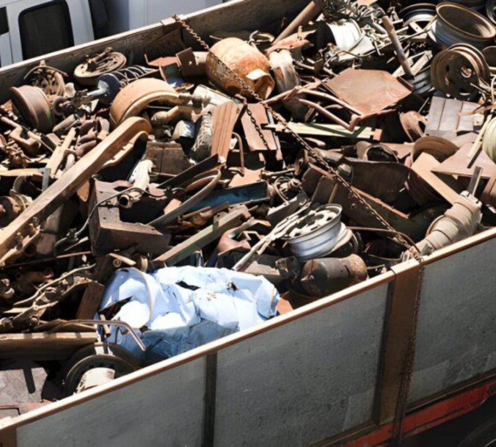 Assorted car and other scrap metal items in a large trailer