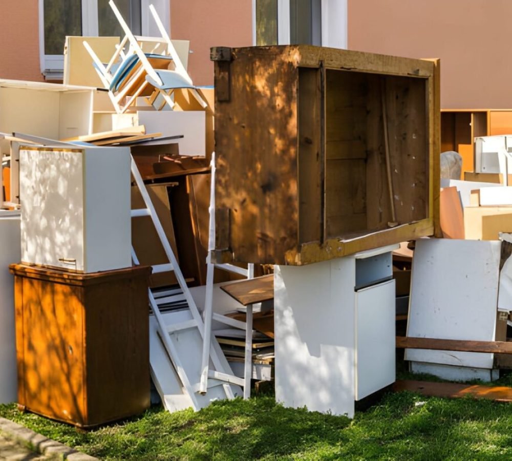 Piled discarded furniture awaiting junk removal
