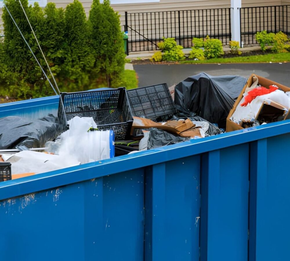 Construction trash dumpsters in an metal container, home house renovation.