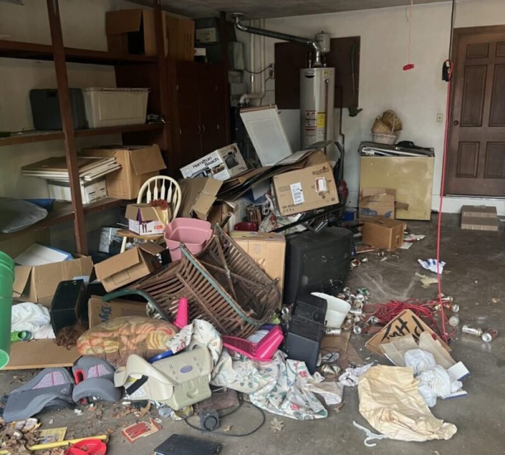 Cluttered garage filled with scattered household items